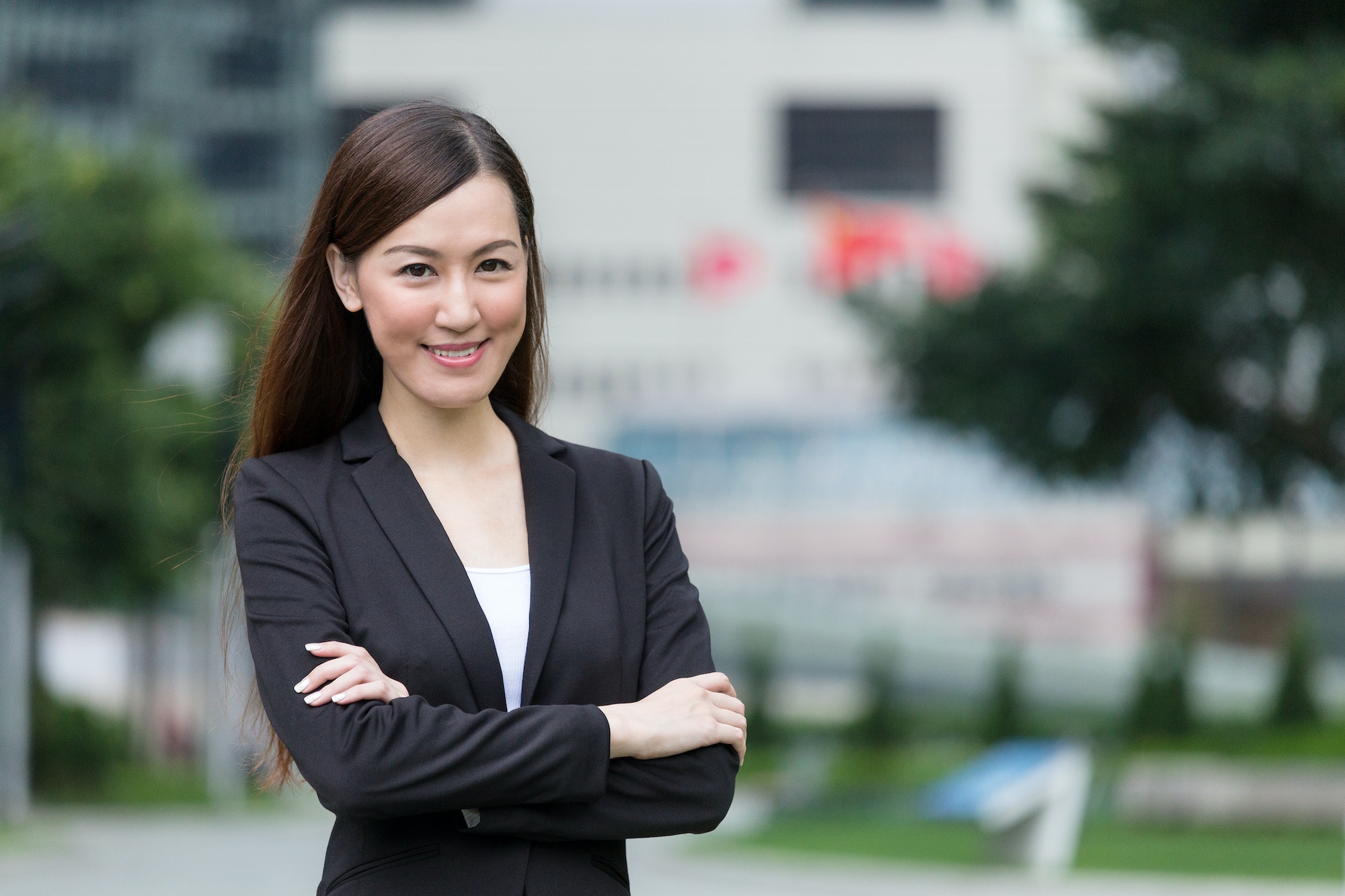 Confident Businesswoman armed crossed